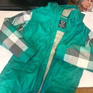Oakley snowboarding, jacket, green and white checkered. Women’s small.